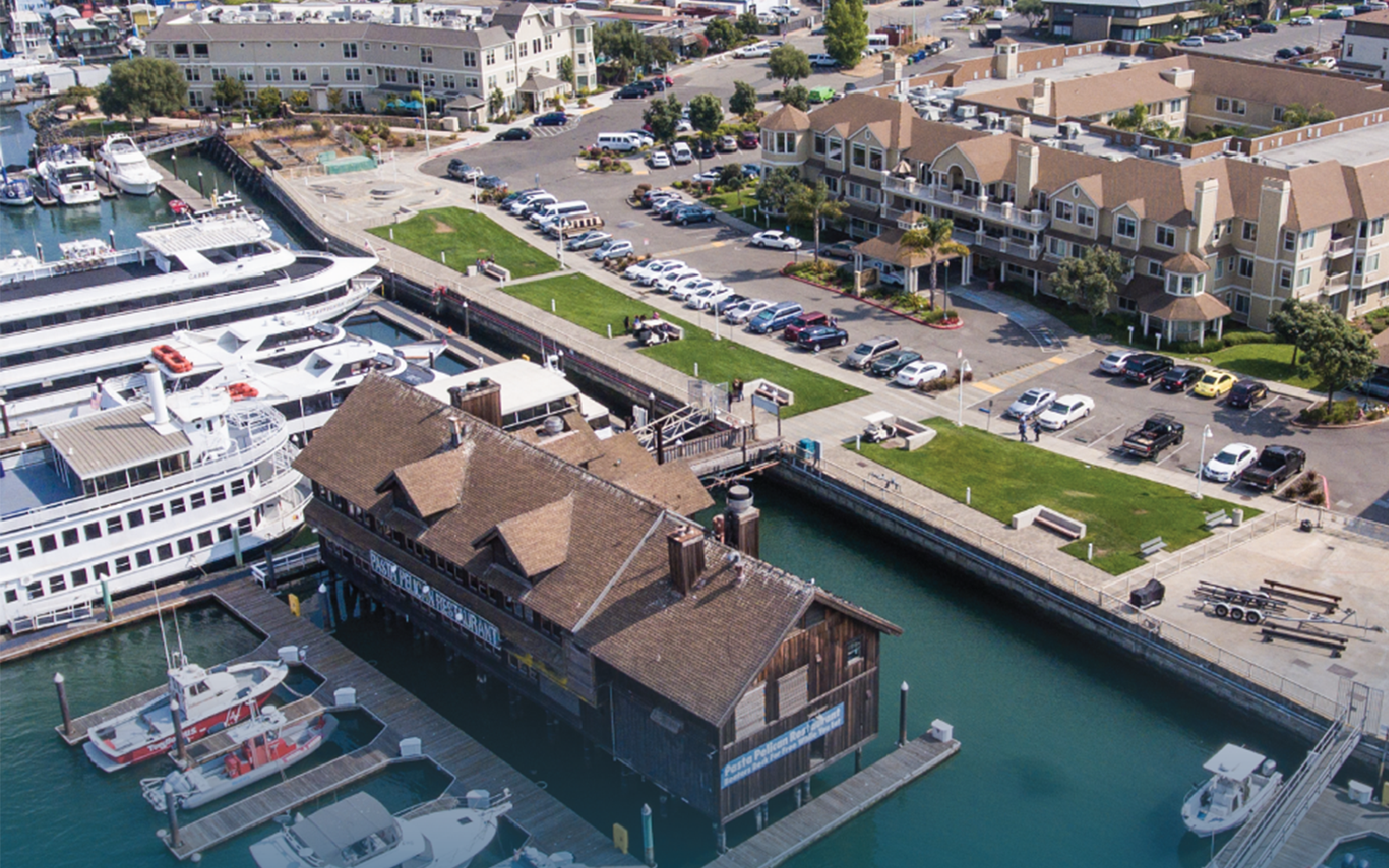 overhead shot of a city with buildings on the water