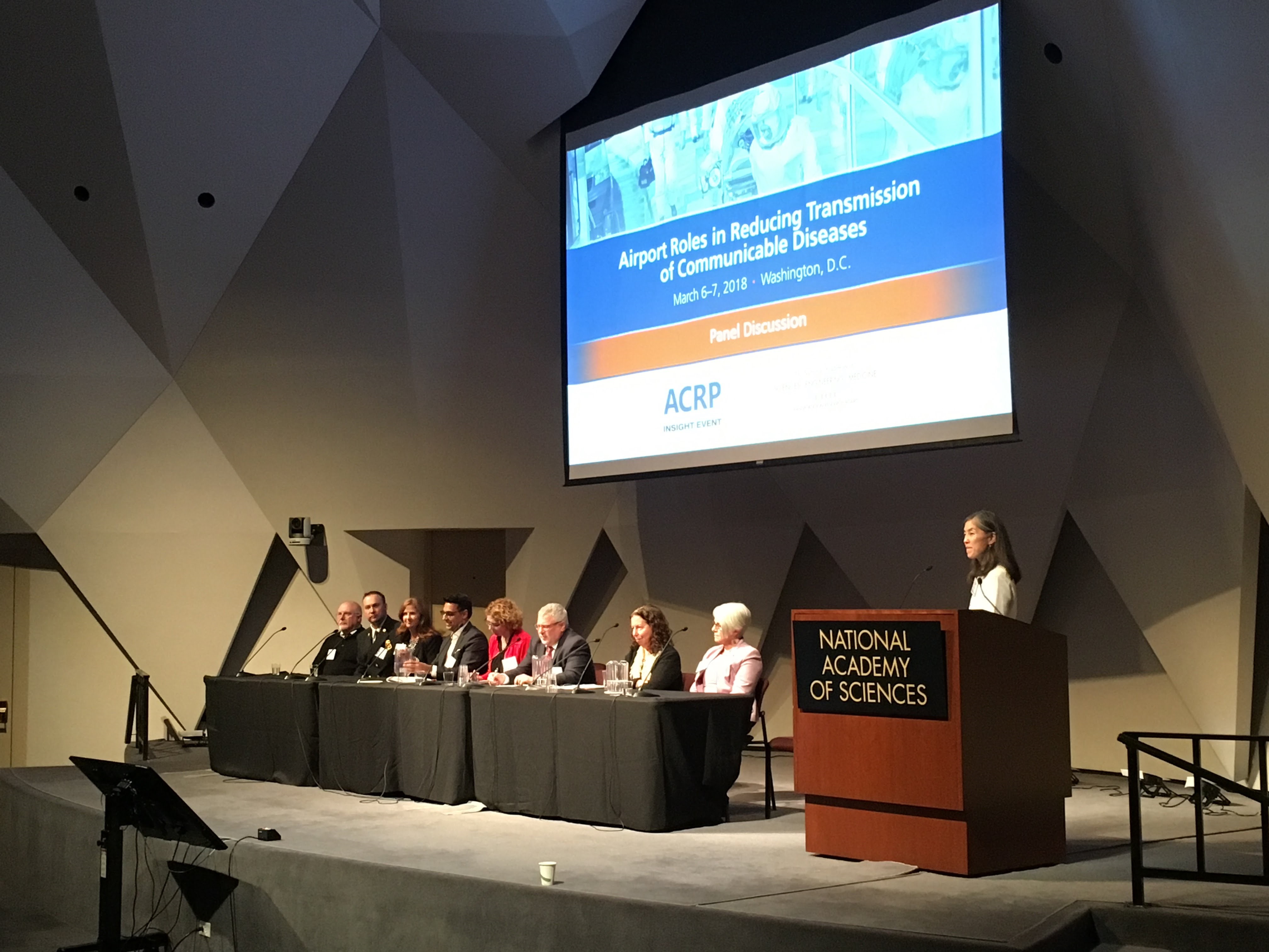 Panelists on stage at an ACRP Insight Event: "Airport Roles in Reducing Transmission of Communicable Diseases"