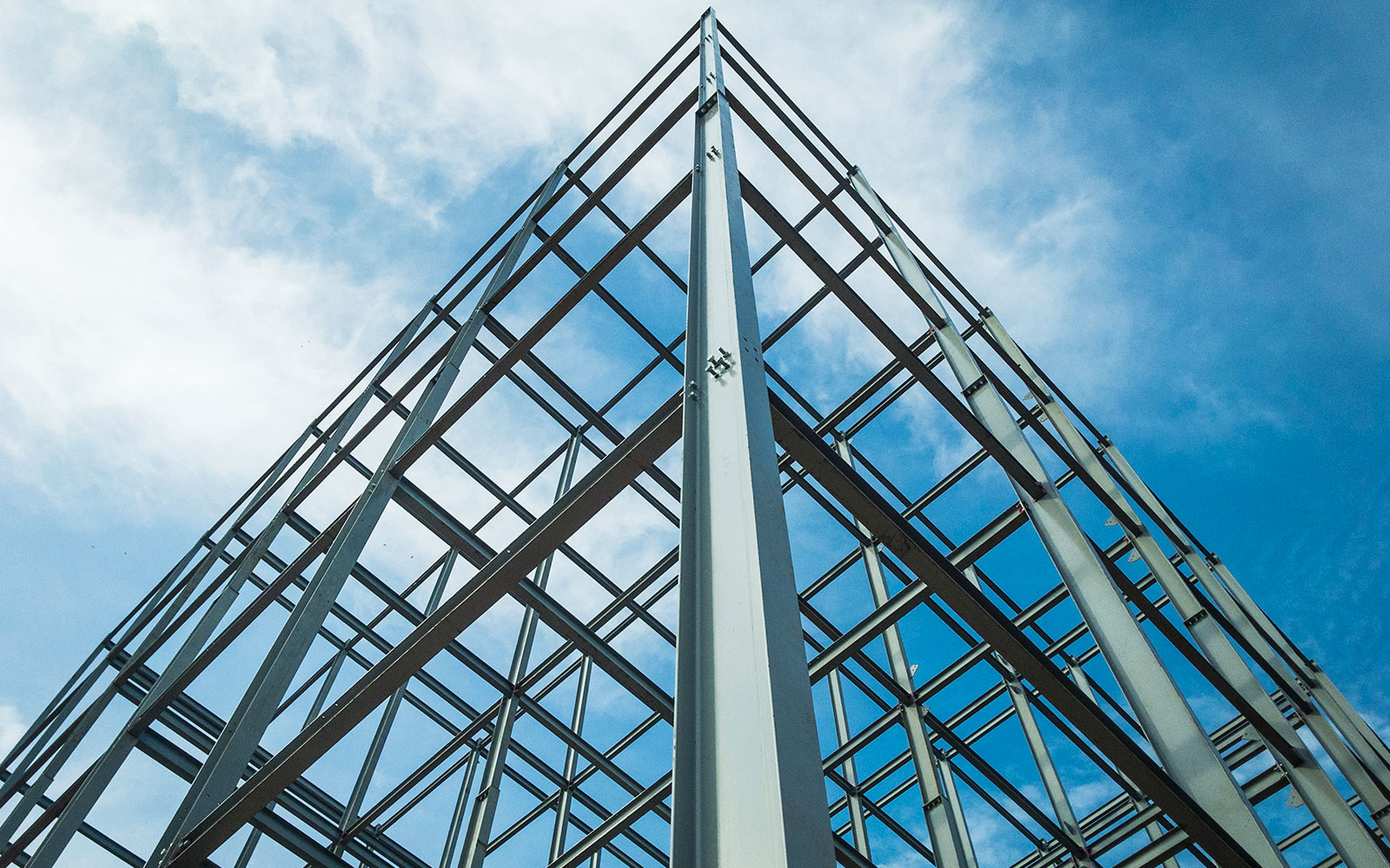 steel beams in front of a blue sky