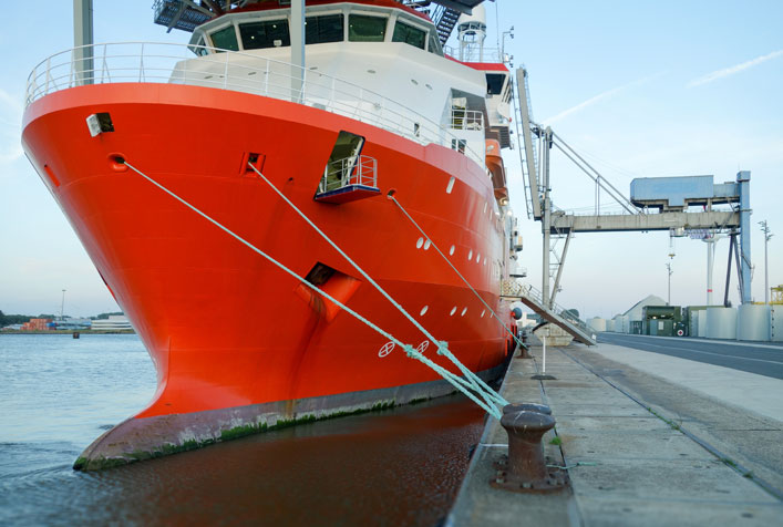 Photo of a diesel engine ship anchored in a port