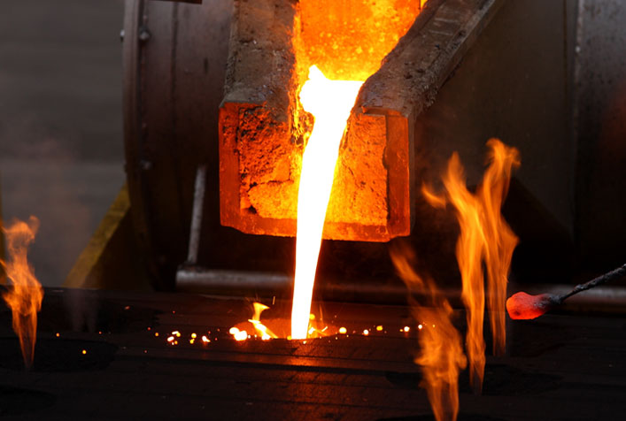 Photo of a molten metal pouring from a smelter