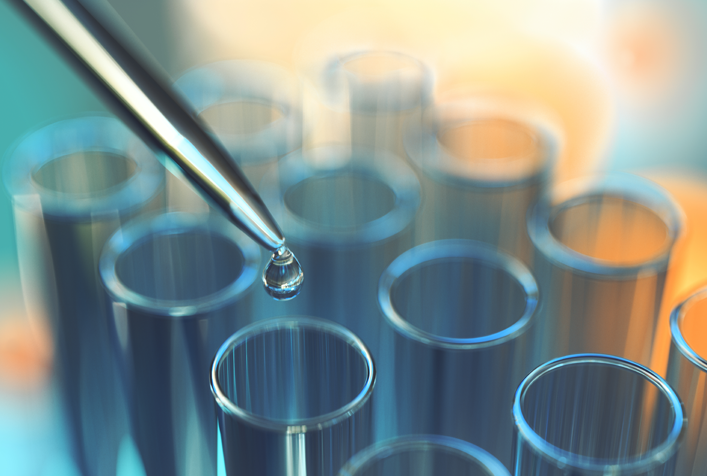 image of lab testing drops into glass tubes