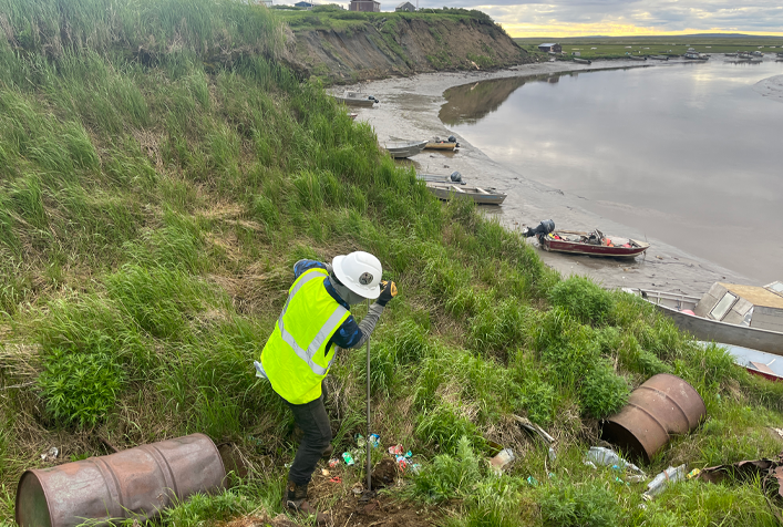 Image of person developing soil borings at landfill site in Alaska