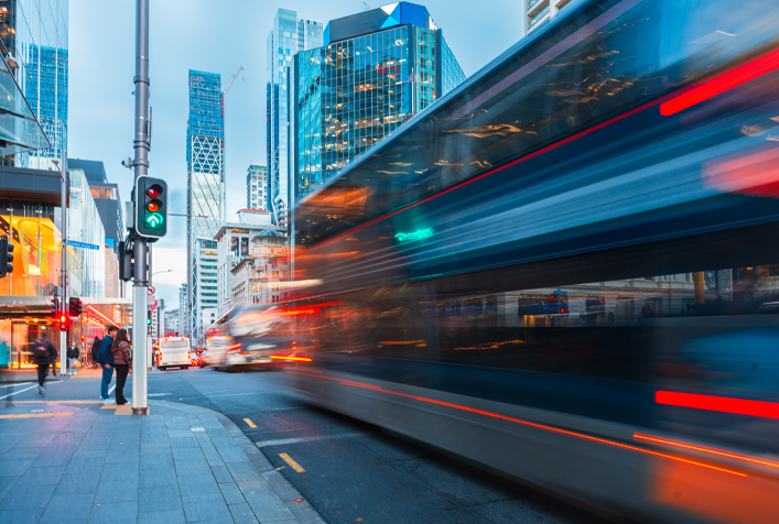photo of city bus going by as a blur
