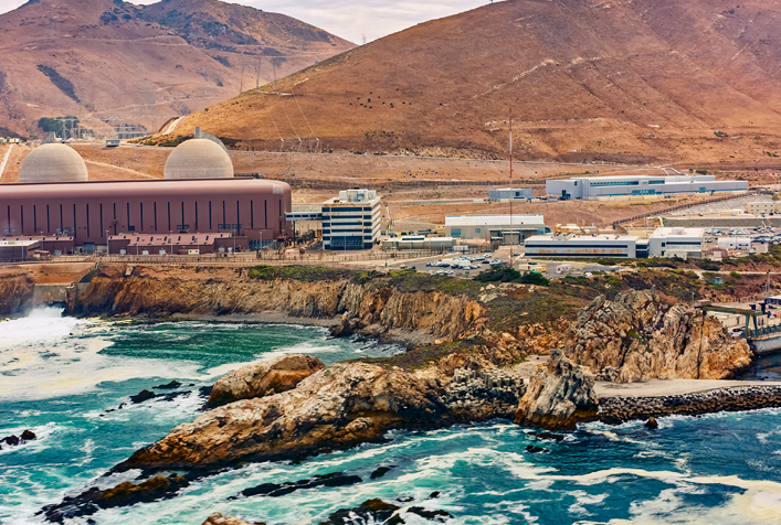 Aerial view of Diablo Canyon Nuclear Power Plant along rocky coastline, San Luis Obispo, California, USA.