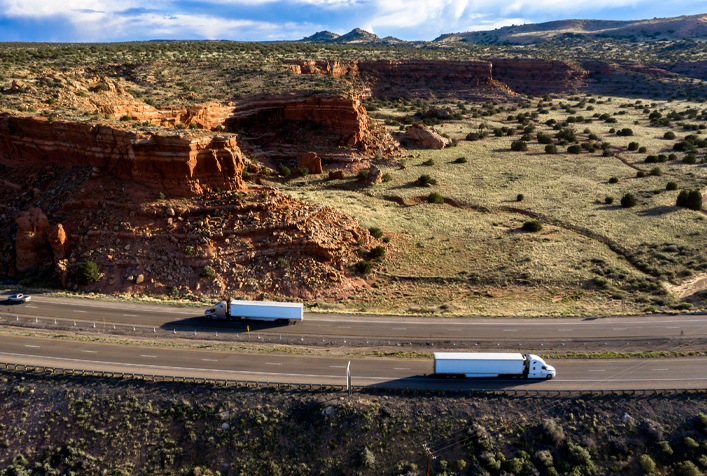 transportation trucks driving along a NM highway